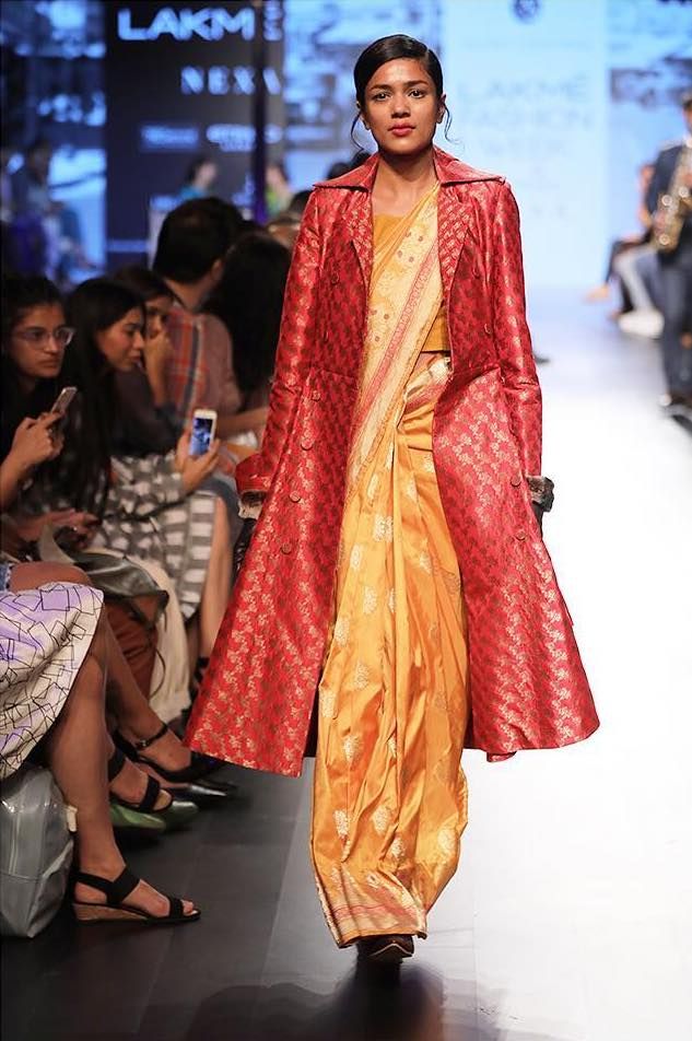 A Trench Coat Worn Over a Saree