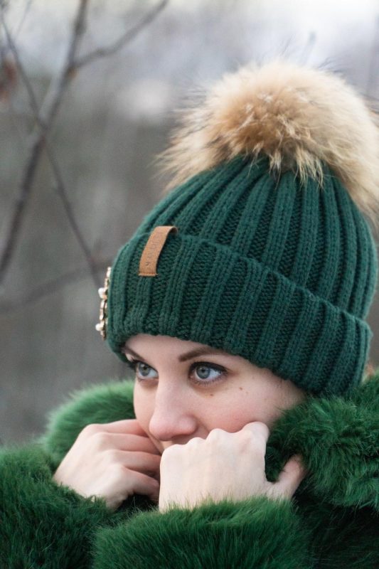 woman wearing green winter outfit